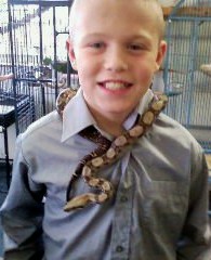 My son and a young red tailed boa