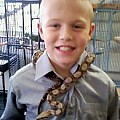 My son and a young red tailed boa